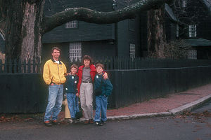 Family in front of House of 7 Gables