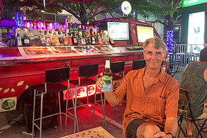 Herb enjoyinga beer at the Suvarnabhumi Night Market