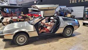 Herb trying out a DeLorean in the Automotive Museum
