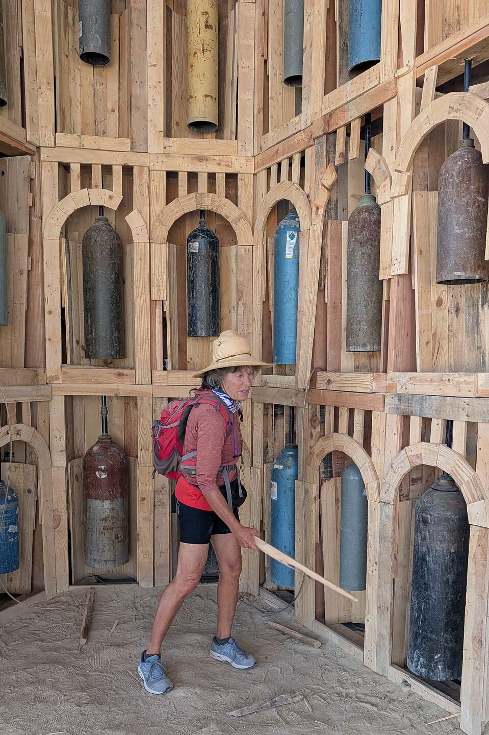 Striking the bells in the pavilion beneath The Man