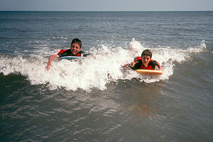 Boys boogie boarding Hunting Island