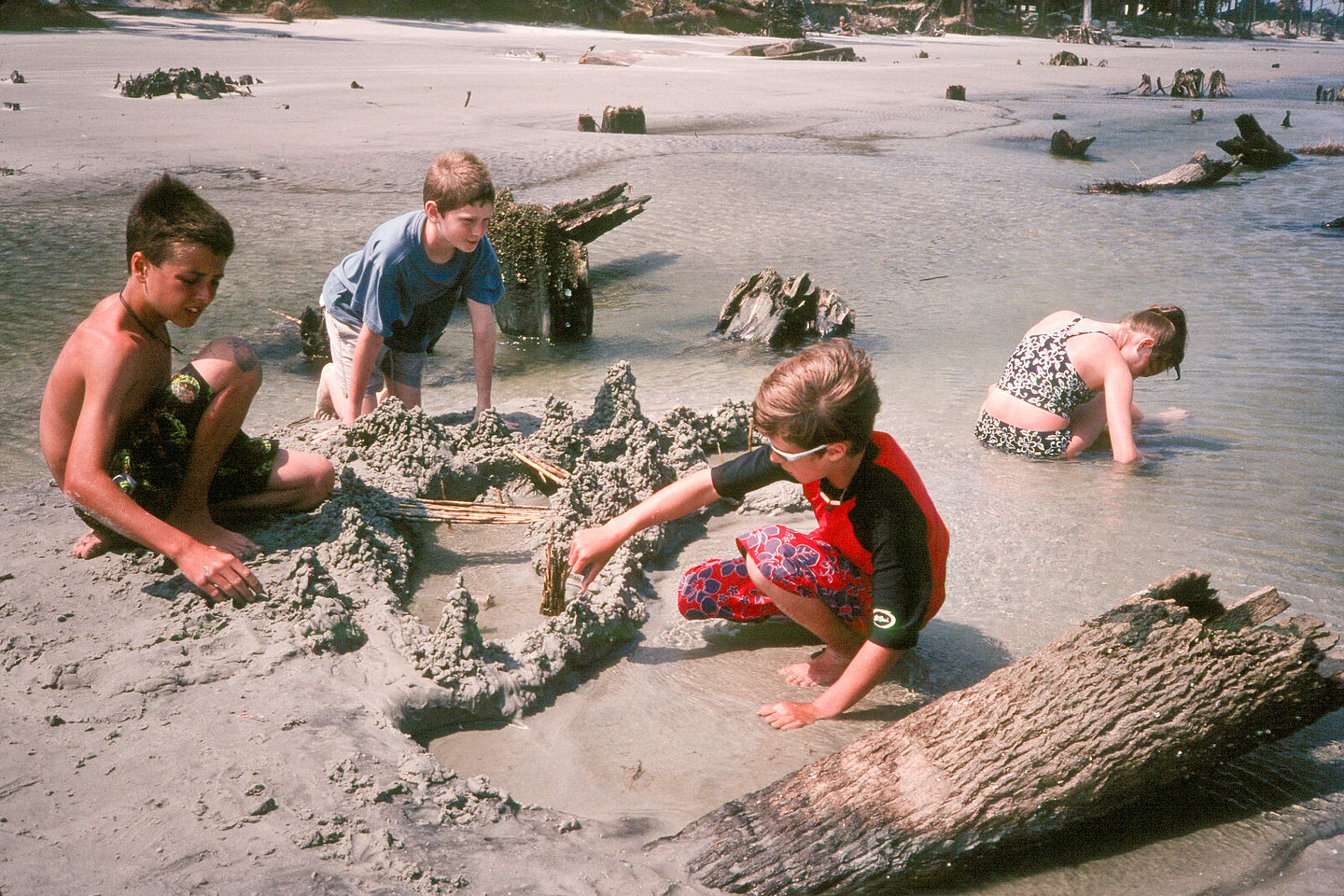 Kids making drip sand castles