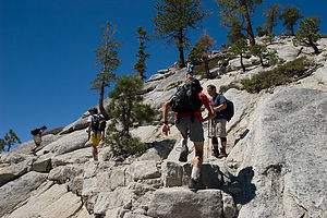 Lolo and boys hiking up Half Dome's shoulder